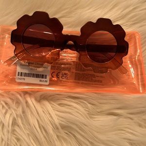 Really cute sunglasses and Dutch braid tool.